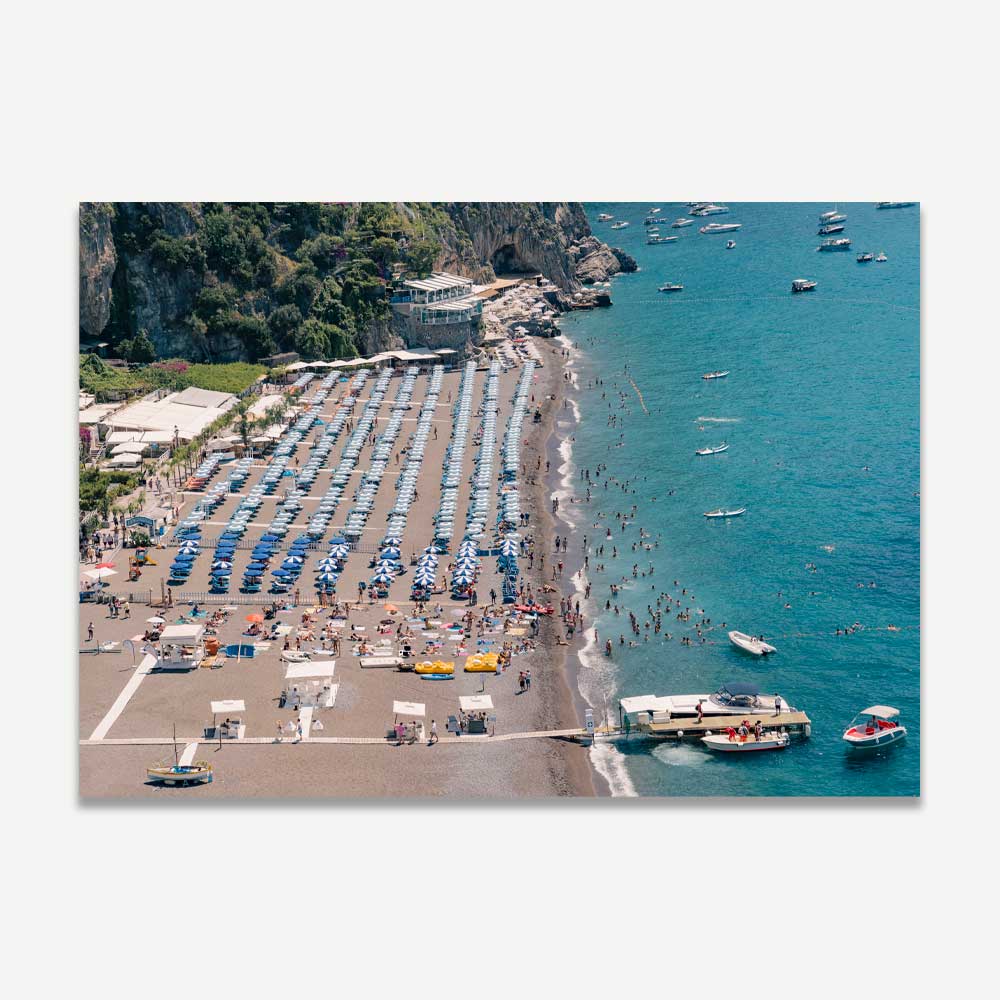 Exclusive photograph of summer at Positano beach, featuring vibrant activity and coastal living, captured during midday. Perfect for elevating your home decor with the timeless allure and vibrant spirit of Positano's summer vibes.