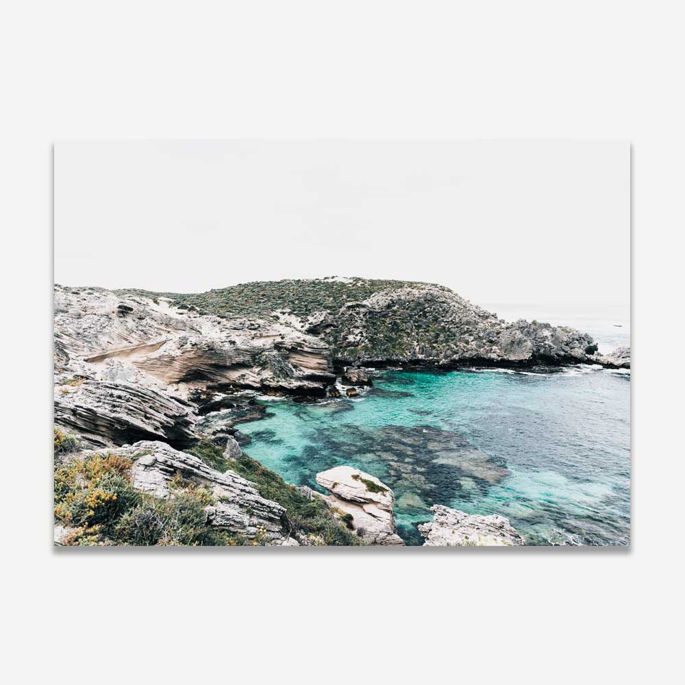 Tranquil scene of Fish Hook Bay in Rottnest Island, Western Australia, against the backdrop of the stunning green sea, ideal for bringing coastal vibes to your space.