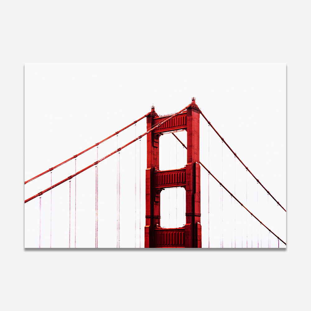 Fine art print of the Golden Gate Bridge tip emerging from clouds, adding sophistication to any space.