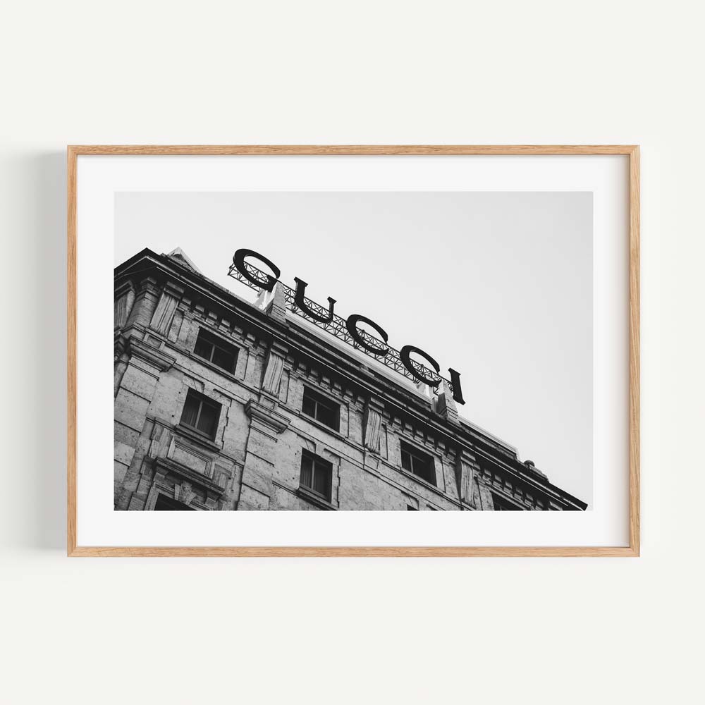 Experience the elegance of Milan's streets with this monochromatic Gucci Sign - perfect for adding flair to your home decor.