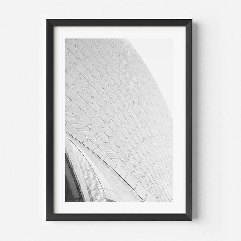 Framed black and white architectural print on a white wall