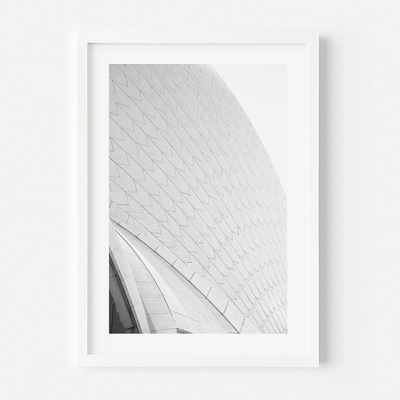Framed black and white architectural print on a white wall