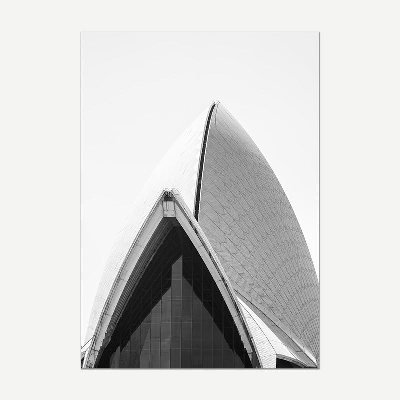 Black and white architectural photograph of a modern building with curved design