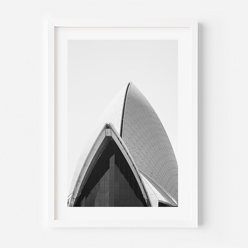 Framed black and white photograph of a architectural structure on a white background