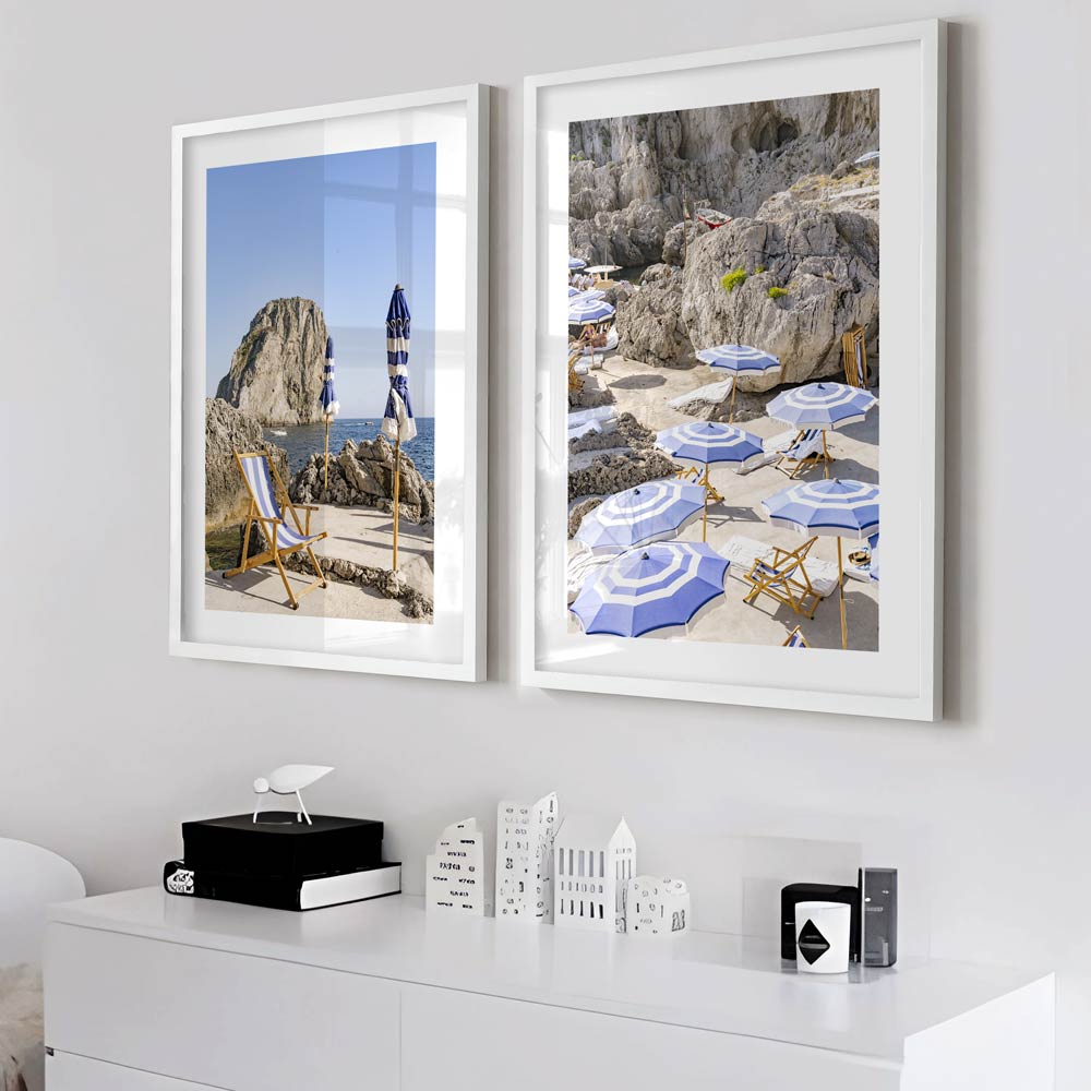 Mediterranean Retreat: La Fontelina, Capri, Italy, with sunbathing chairs and umbrellas framed by mountains, ideal for fine art prints 