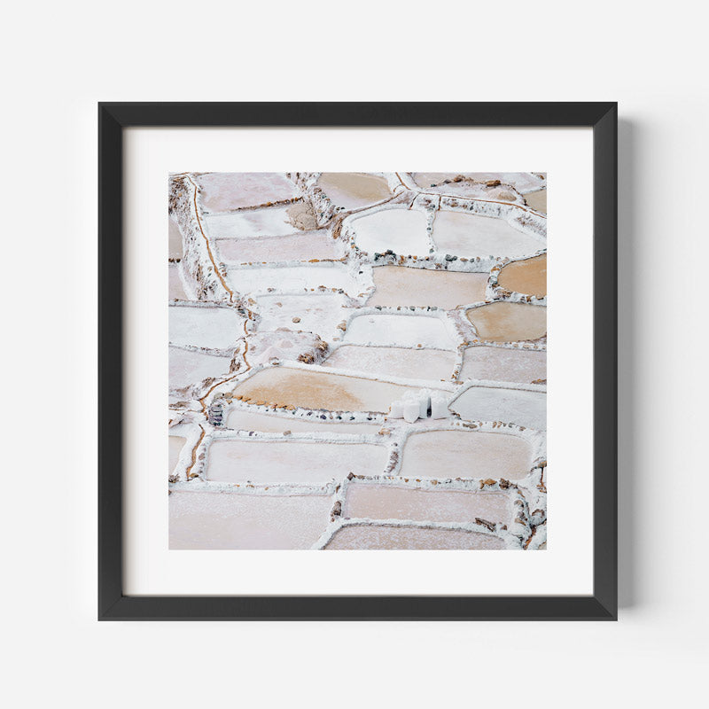 Framed artwork of a textured beige and white pattern on a light gray background