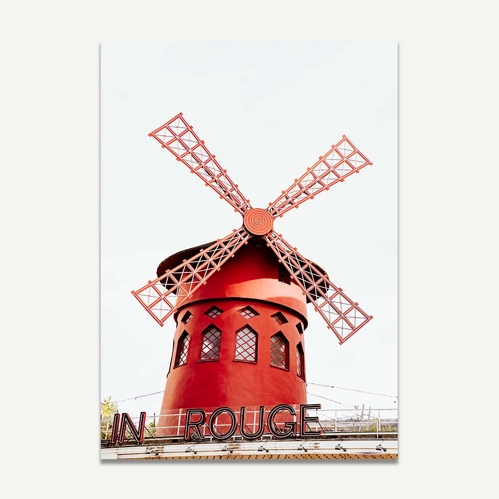 Iconic Moulin Rouge in Montmartre captured in peaceful morning light, adding Parisian charm to any space.
