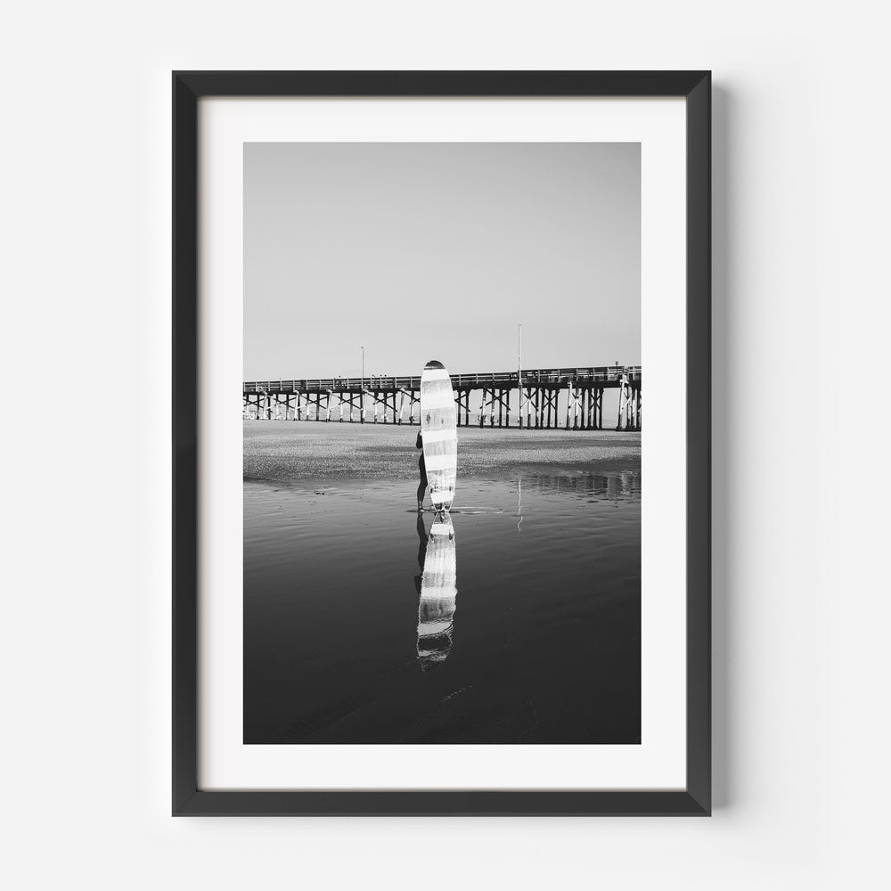Explore the beauty of Newport Beach with this stunning photograph of a longboard surfer - Great for canvas prints.