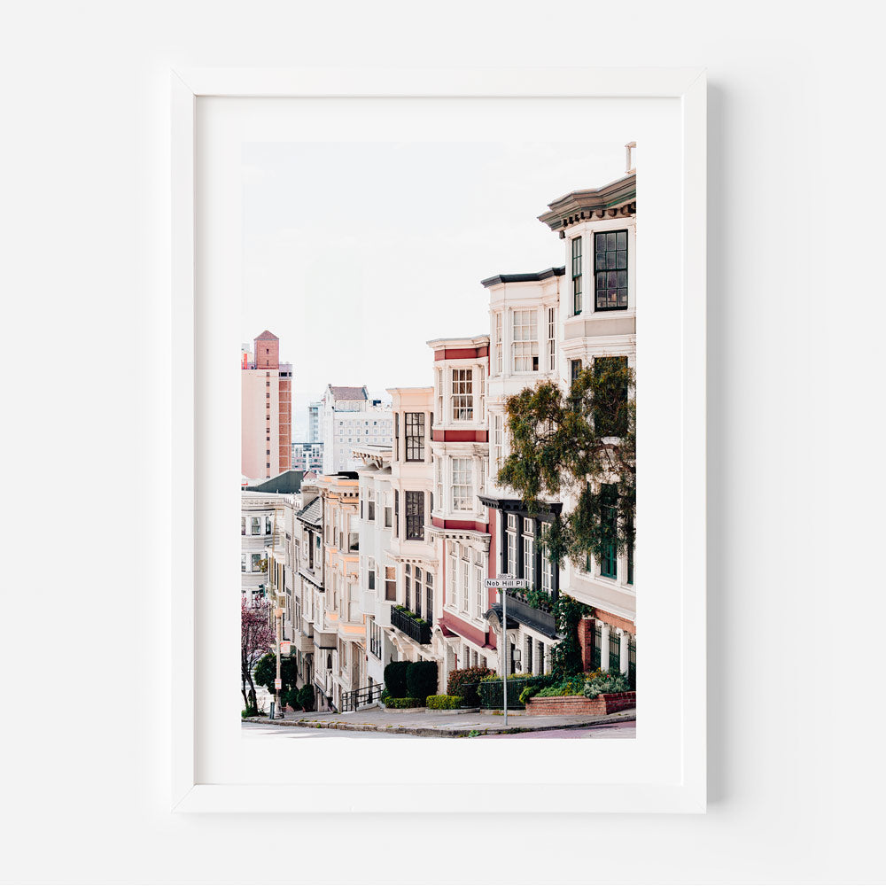 Victorian-style home in Nob Hill with intricate details and San Francisco skyline backdrop – perfect for art decor wall art.