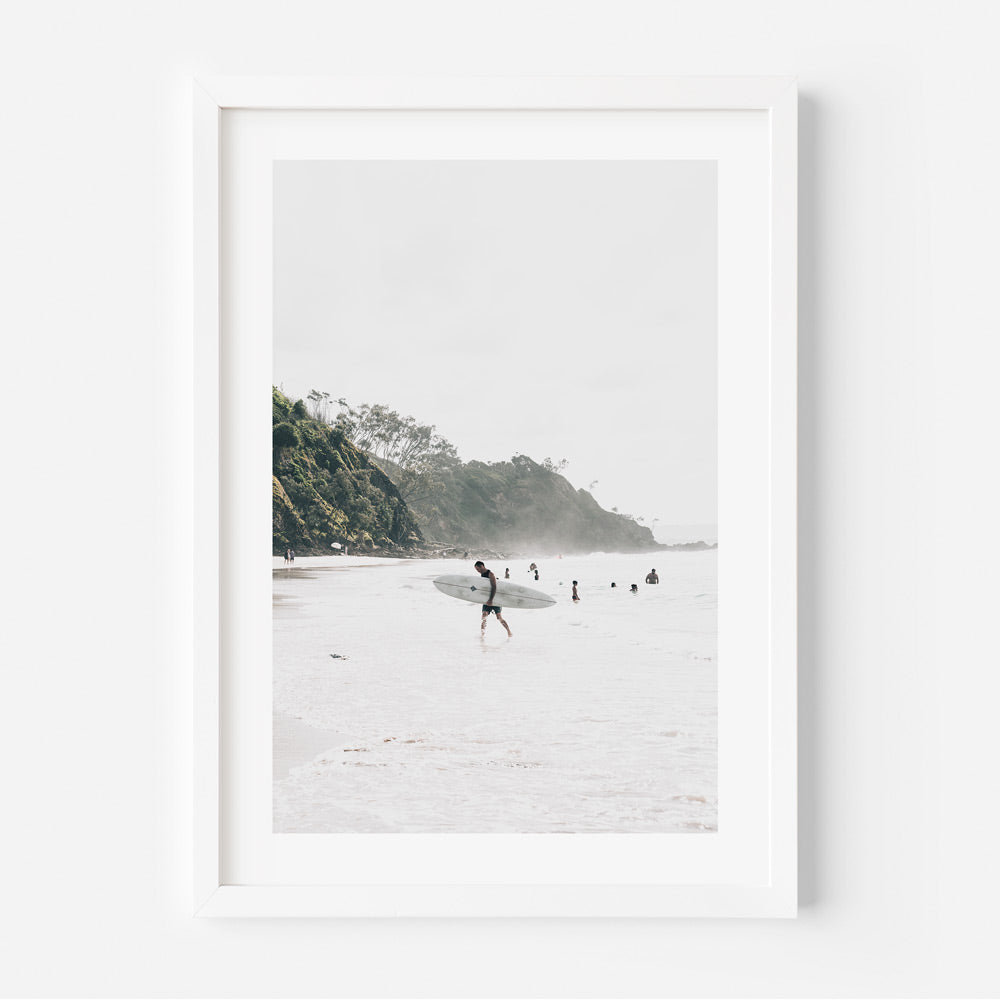 Discover the serenity of North Wategos, Byron Bay, as a man carries a skateboard in this captivating canvas print.