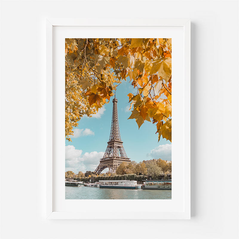 Framed print of the Eiffel Tower with autumn leaves in the foreground