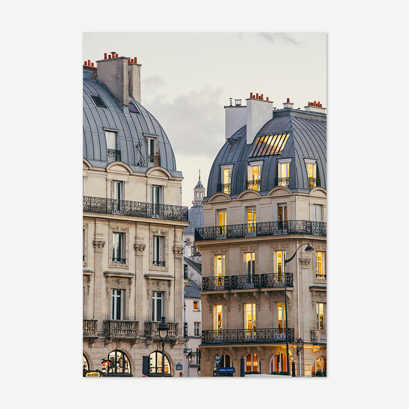 Stylized image of a Parisian building facade with architectural details.