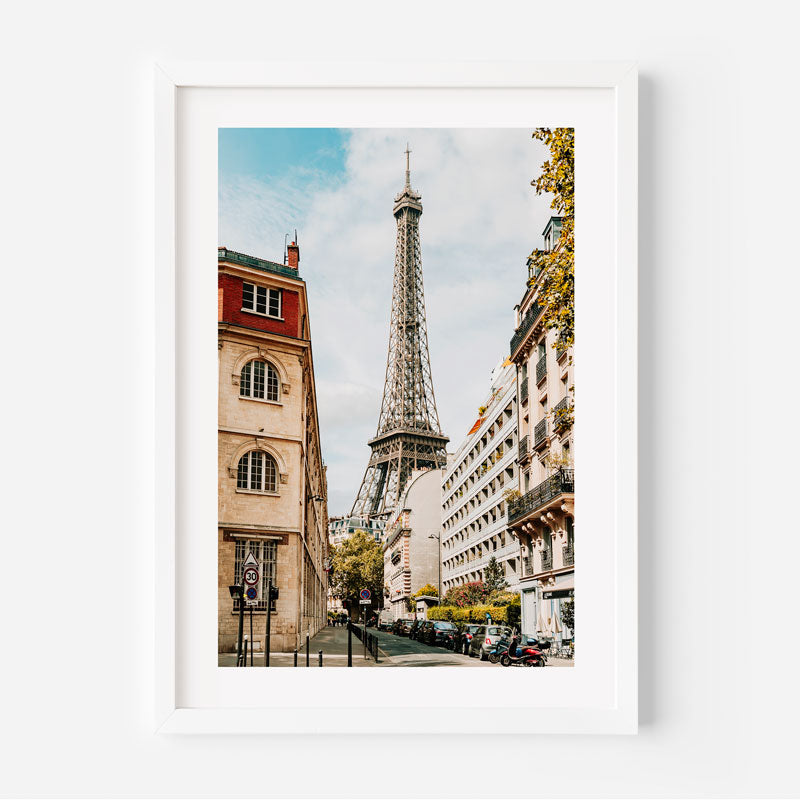 Framed photograph of the Eiffel Tower in Paris with buildings on either side.