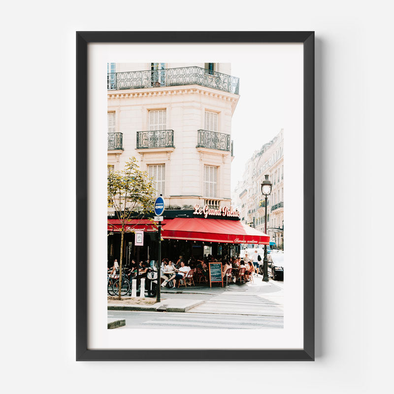 Framed photograph of a street scene with a cafe in Paris