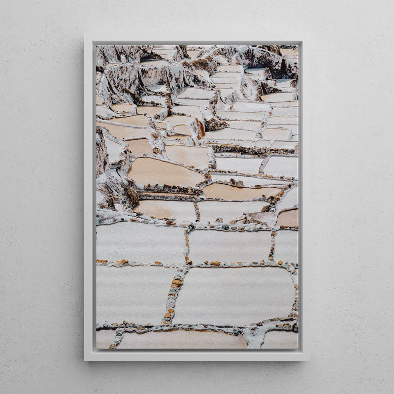 Framed abstract art piece with a textured pattern on a gray wall