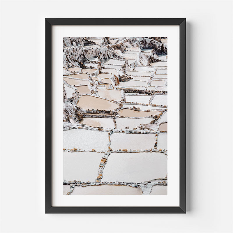 Framed photograph of a stone staircase on a white wall