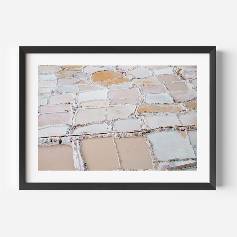 Framed artwork of a stone wall pattern on a white background