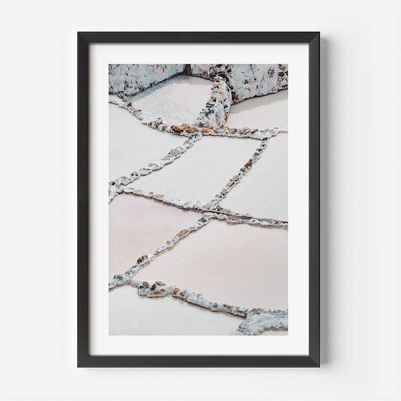 Framed photograph of a salt mine landscape with geometric patterns.