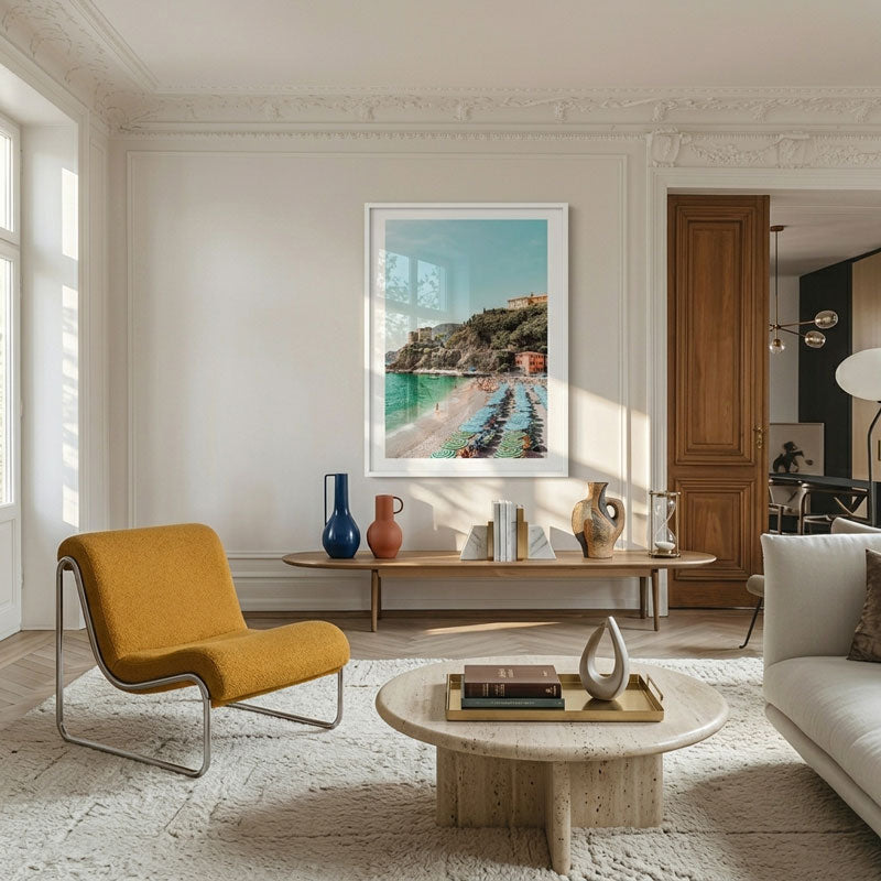 Modern living room with yellow chair, marble coffee table, and artwork on the wall.