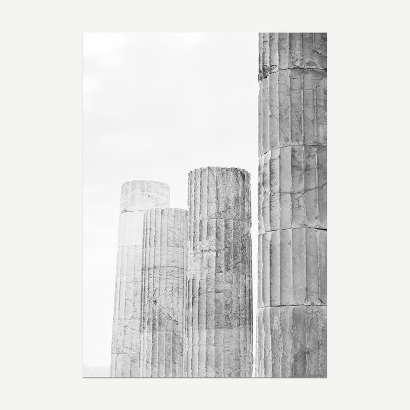 Black and white image of stacked stone columns on a white background