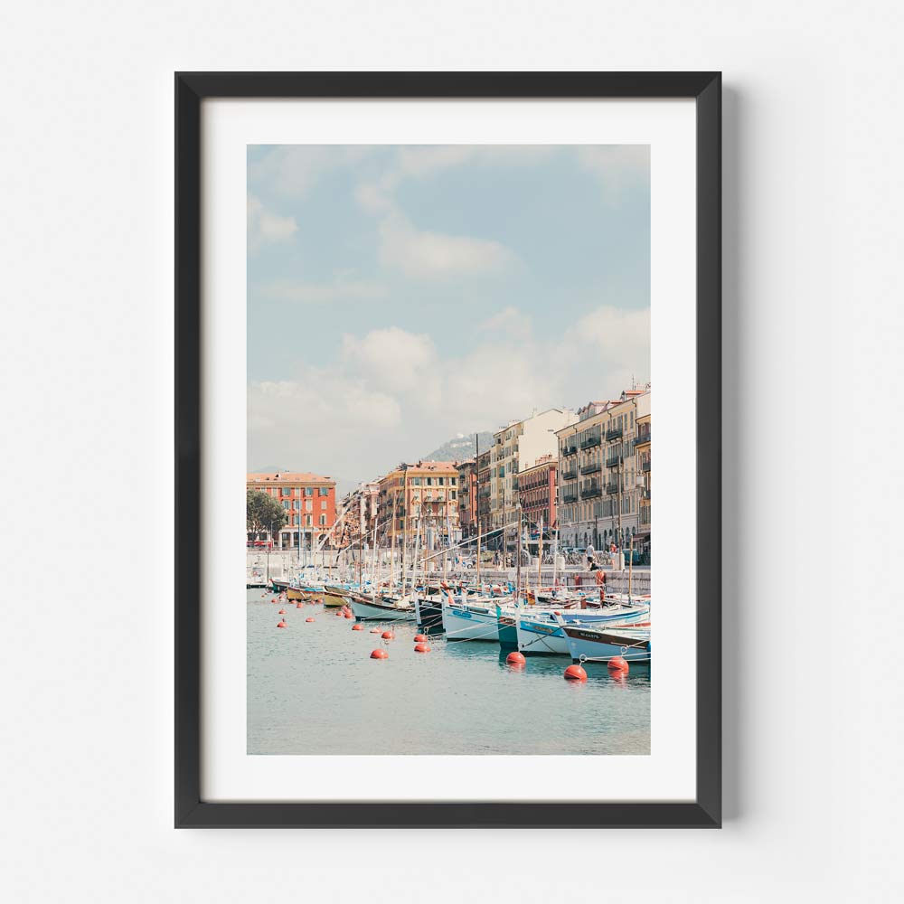 Transport yourself to the picturesque harbor of Port Lympia, NICE, CÔTE D'AZUR, FRANCE with this exquisite canvas print