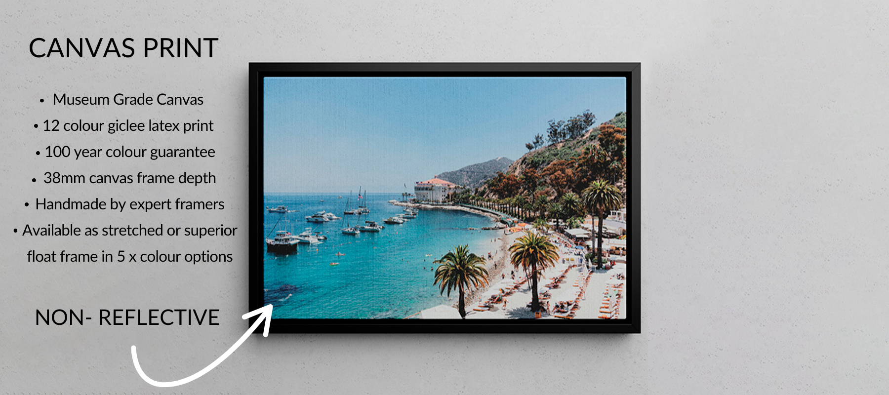 Framed canvas print of a coastal scene with palm trees and boats on a white wall with all the properties of canvas print.