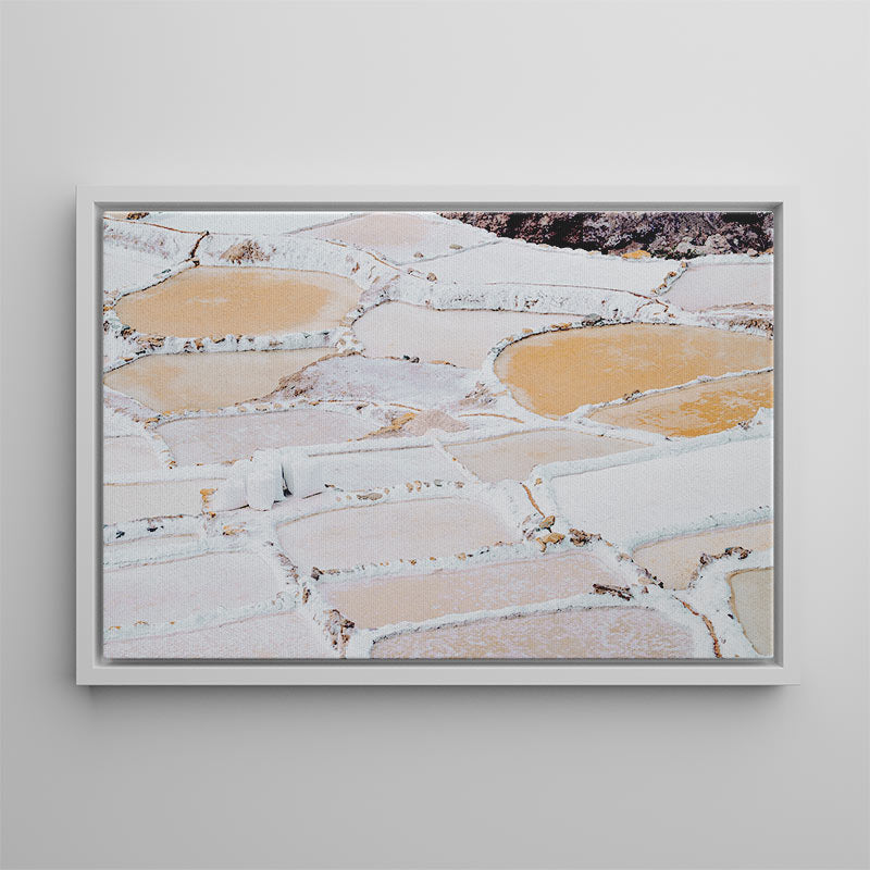 Framed photograph of a natural landscape with water features on a gray wall