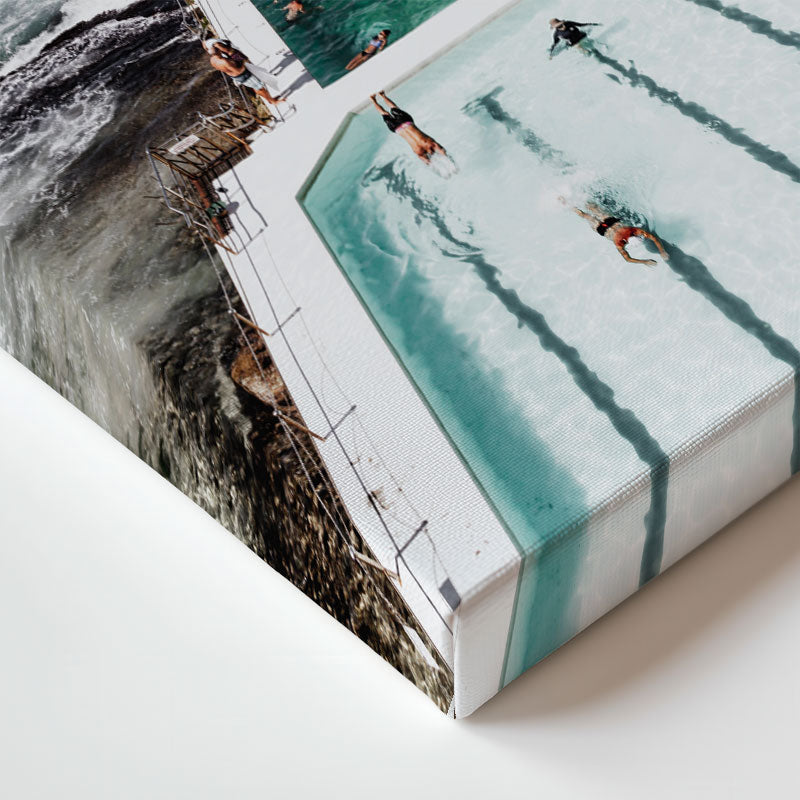 People swimming in a pool with a scenic background