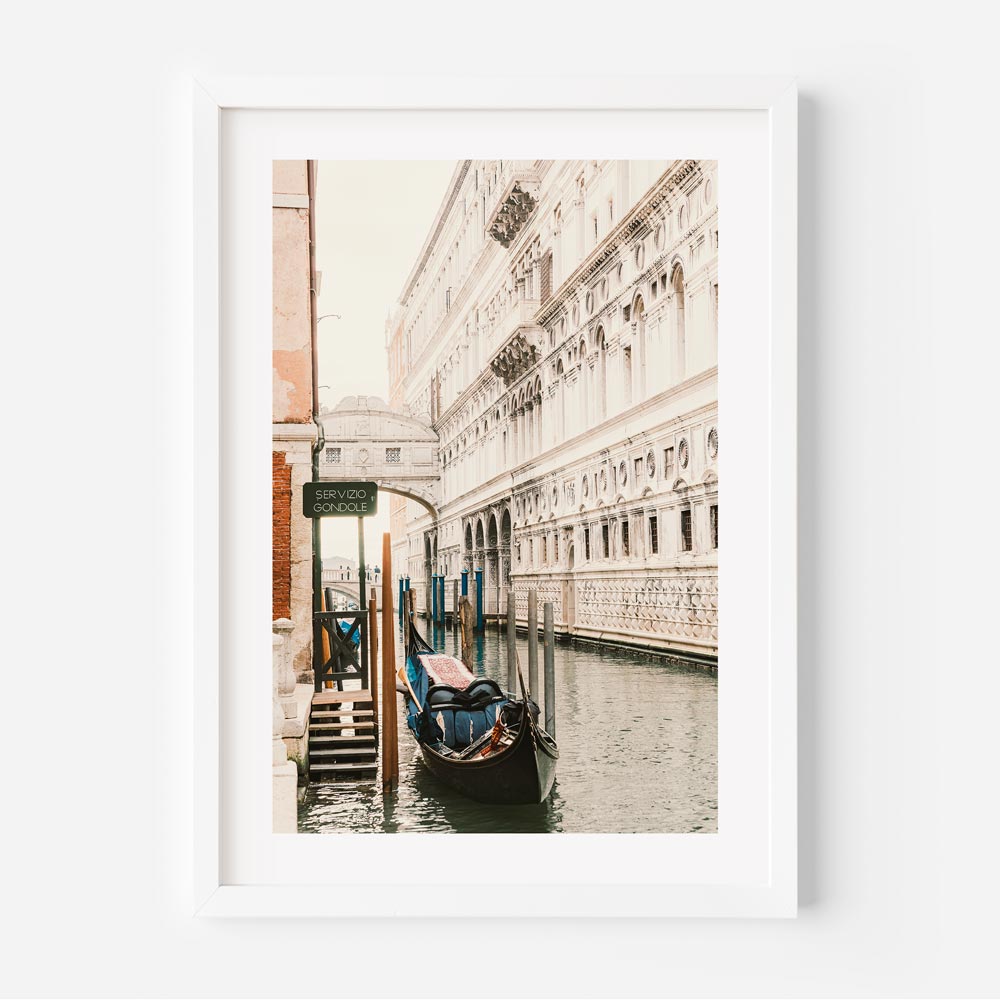 Servizio Gondole, Venice Italy: A charming photograph capturing a boat and water - Perfect for wall art and home decor.