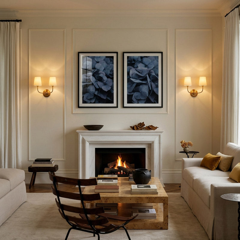 Living room with fireplace, white walls, and decorative elements.