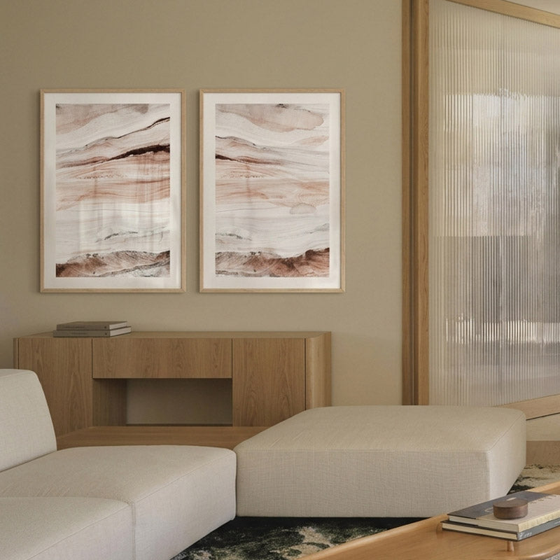 Living room with abstract art on the wall and a sofa.