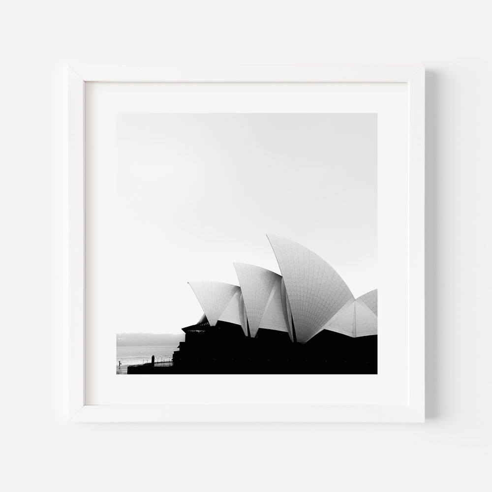 Iconic Sydney Opera House: Elegant black and white framed image with the sea in the background, perfect for minimalist wall art.