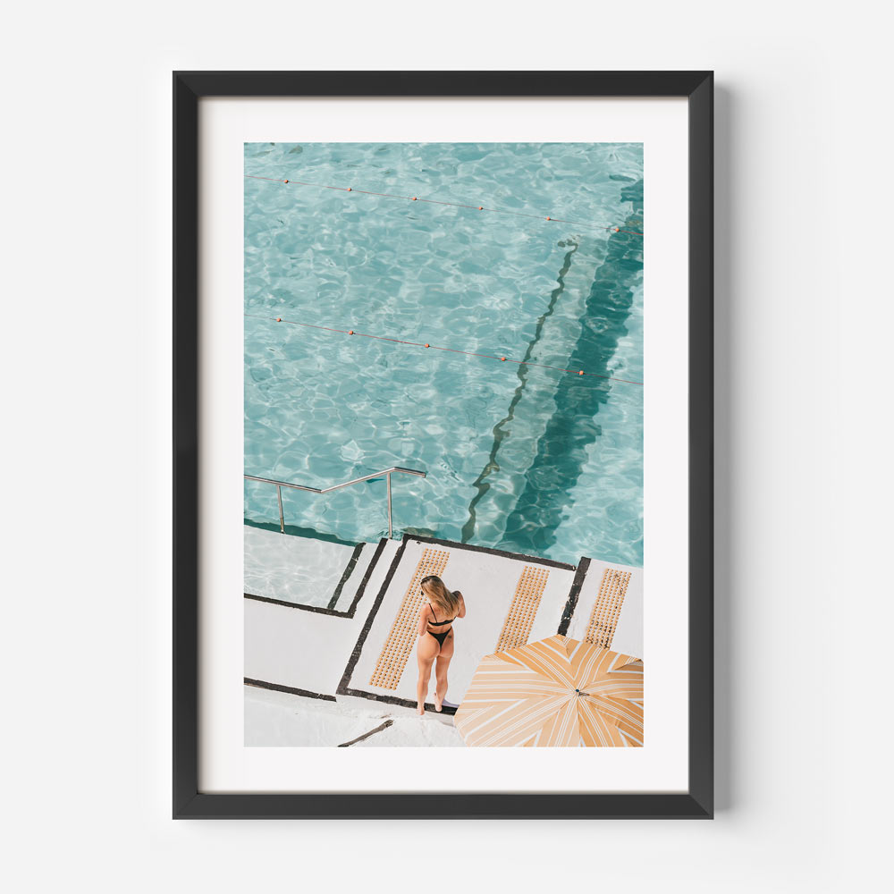 Summer vibes captured in a swimmer’s moment at Bondi Icebergs, perfect for any living space.
