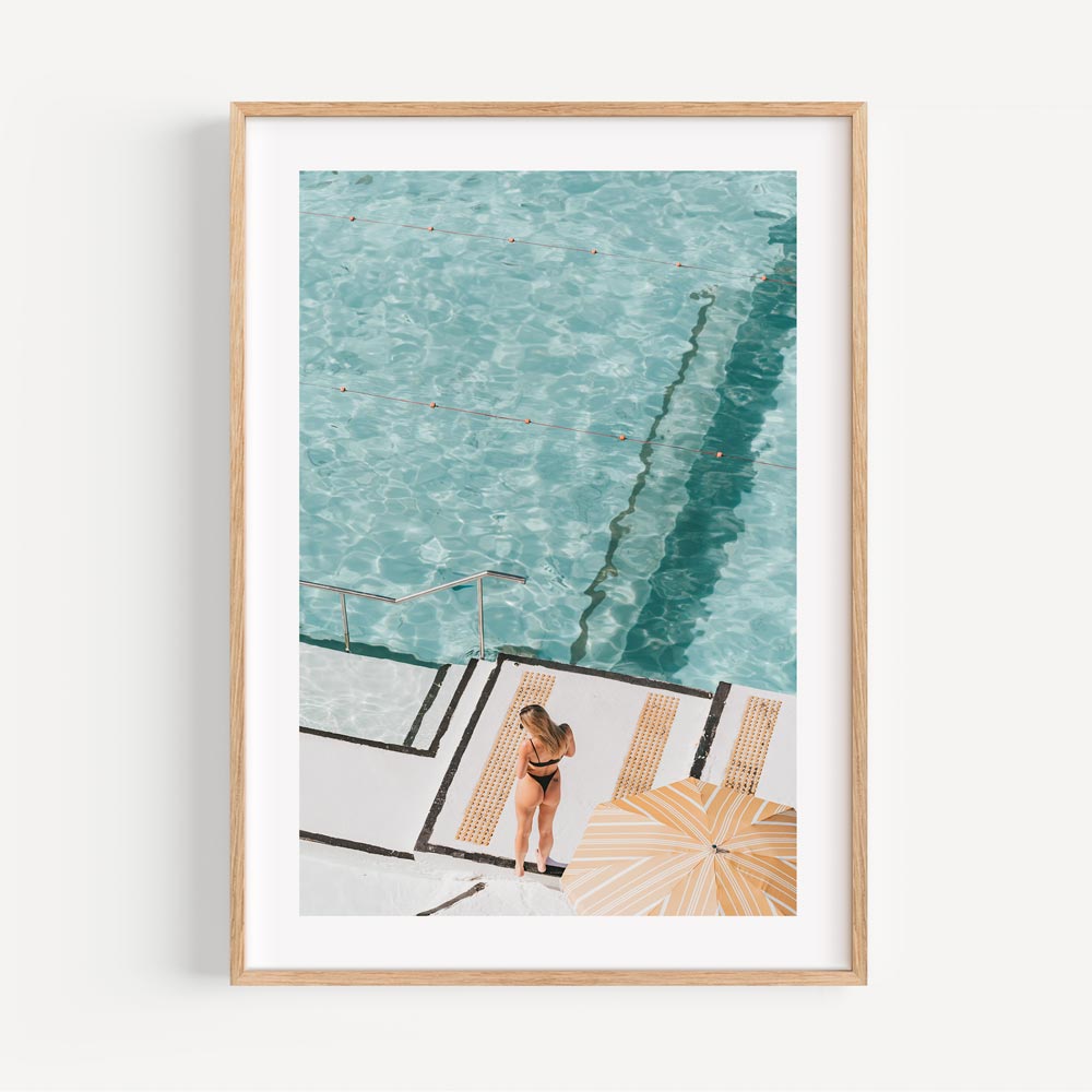 Swimmer by the Bondi Icebergs ocean pool, encapsulating the rejuvenating spirit of coastal living.
