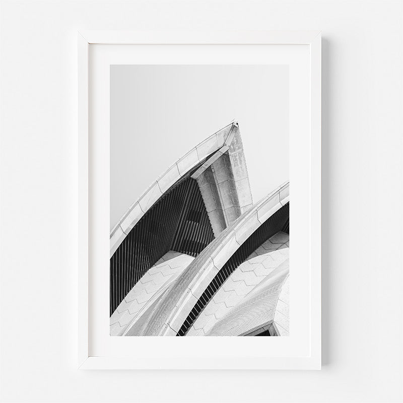 Framed black and white architectural print on a white wall