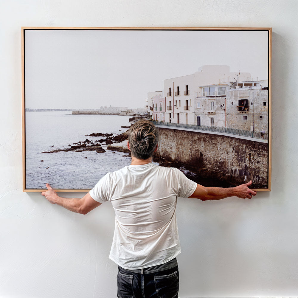Framed coastal wall art of historic Syracuse seafront homes — soft neutral tones perfect for beach art and nature-inspired décor.