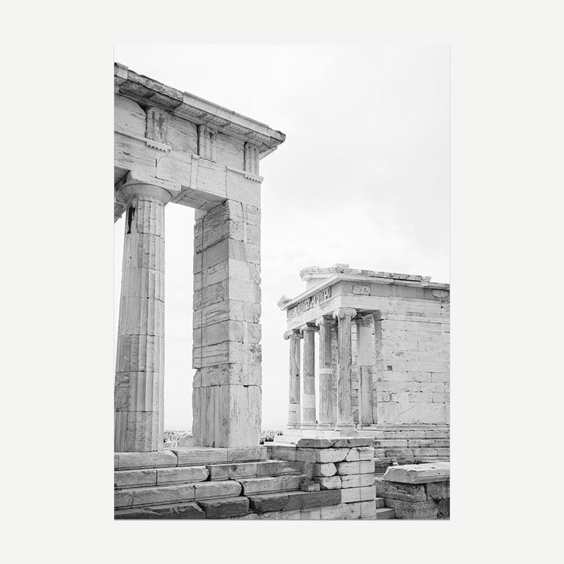 Black and white photograph of ancient temple ruins with columns.