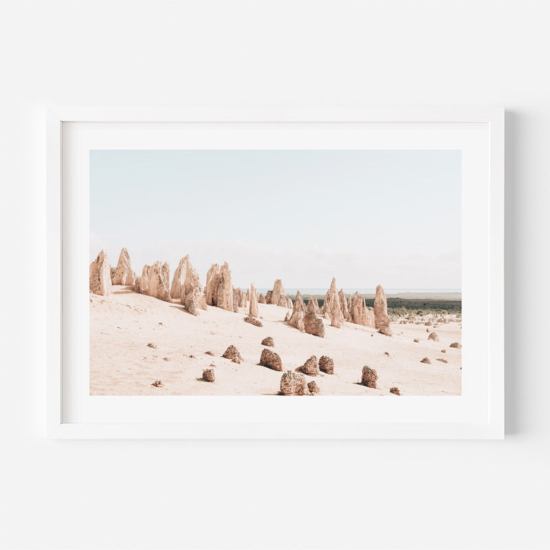 Framed photograph of sandstone pinnacles in a desert landscape