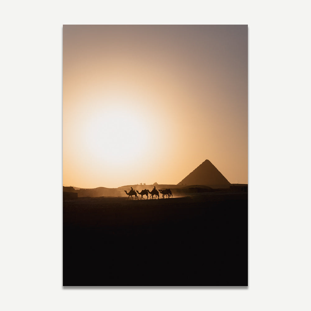 A print featuring a photograph of the Pyramids of Giza at sunset, with a silhouette of camels in the foreground.