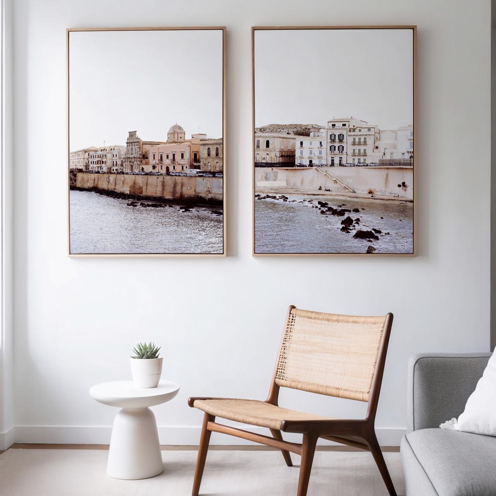 Coastal wall art of historic Syracuse, Sicily, displayed in a modern interior—framed beach art adding Mediterranean charm and soft neutral tones to coastal home décor.