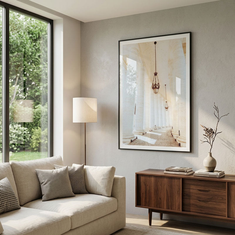 Modern living room with beige sofa, wooden sideboard, and framed artwork on wall.