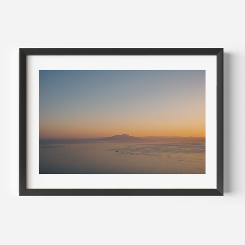 Vulcano Di Pompei wall artwork: Mt. Vesuvius framed photo, featuring a boat at sunset.