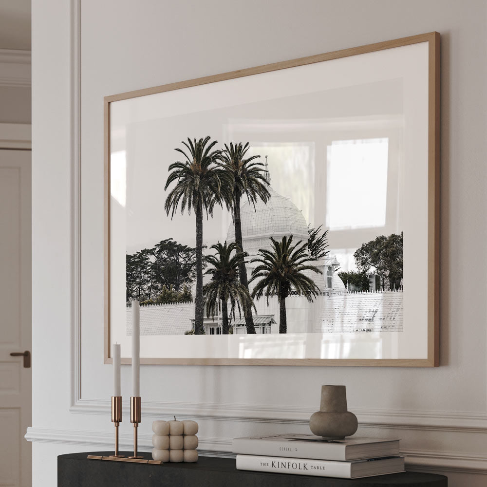 Minimalist art print of the Conservatory of Flowers in San Francisco with serene palm trees and neutral tones.