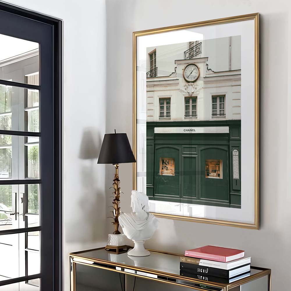 Wall art featuring a picturesque building with a clock, capturing the elegance of the Chanel building in Paris, France.