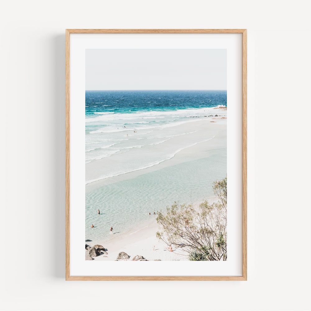 Experience the serenity of Rainbow Bay Beach, Queensland, Australia through this framed artwork.