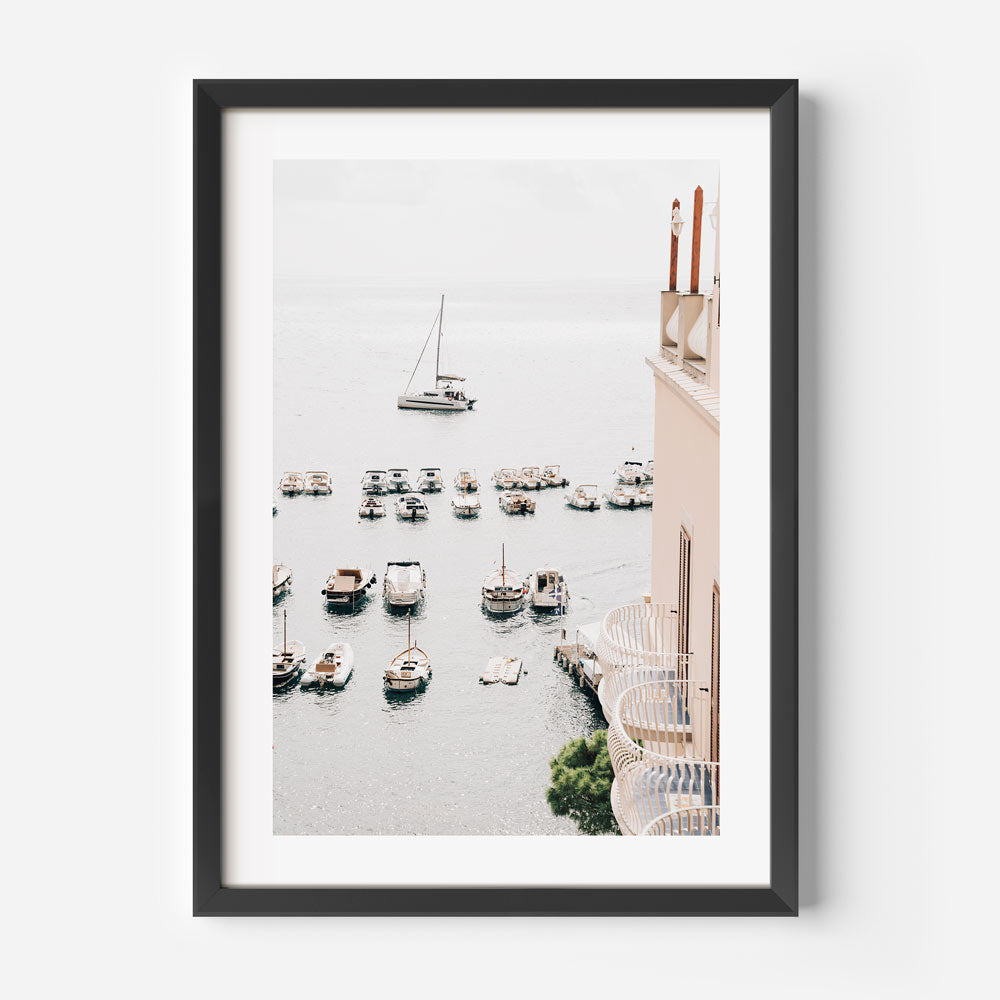 Seaside Serenity: Relaxing view from Amalfi hotel, with boats gently floating in the sea against the picturesque Amalfi Coast landscape, perfect for enhancing your wall decor.