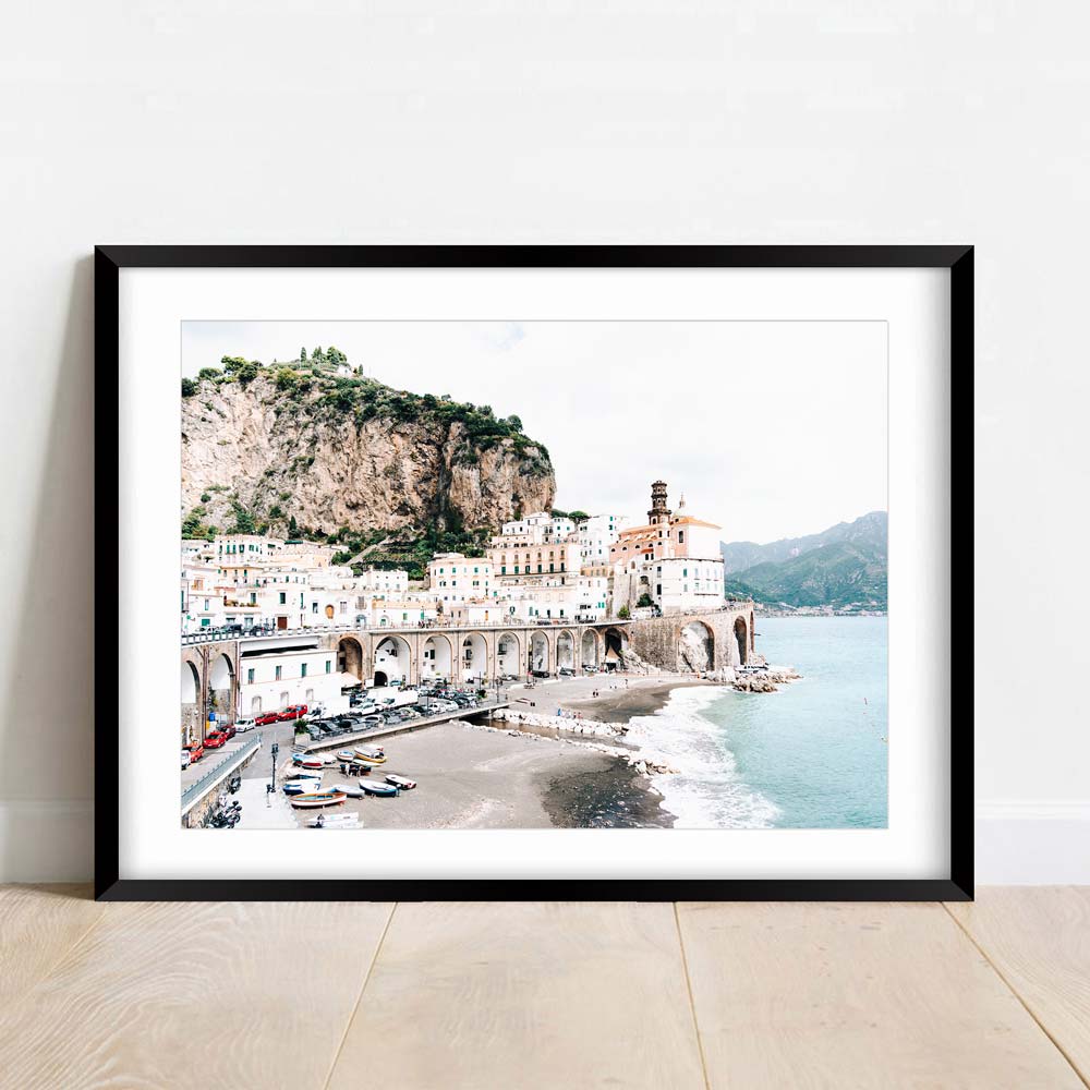 Enhance your living room with this beautiful wall art of a beach and mountain from Atrani, Italy.