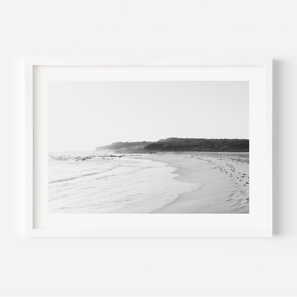 A serene black and white photo of the beach with morning mist at Maroubra Beach