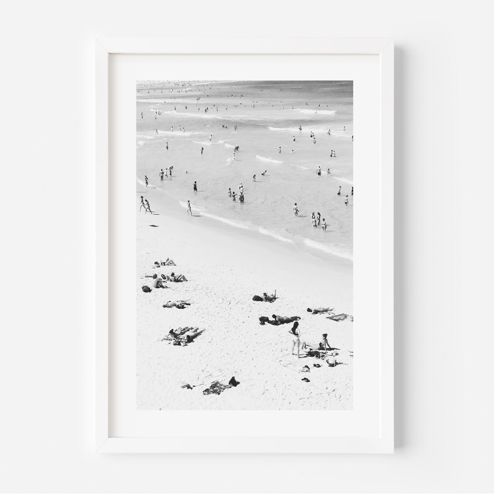 Ocean Vibes: A framed snapshot of Bondi Beach, where bathers and sun-seekers enjoy the sand and surf, ideal for coastal-inspired wall art.