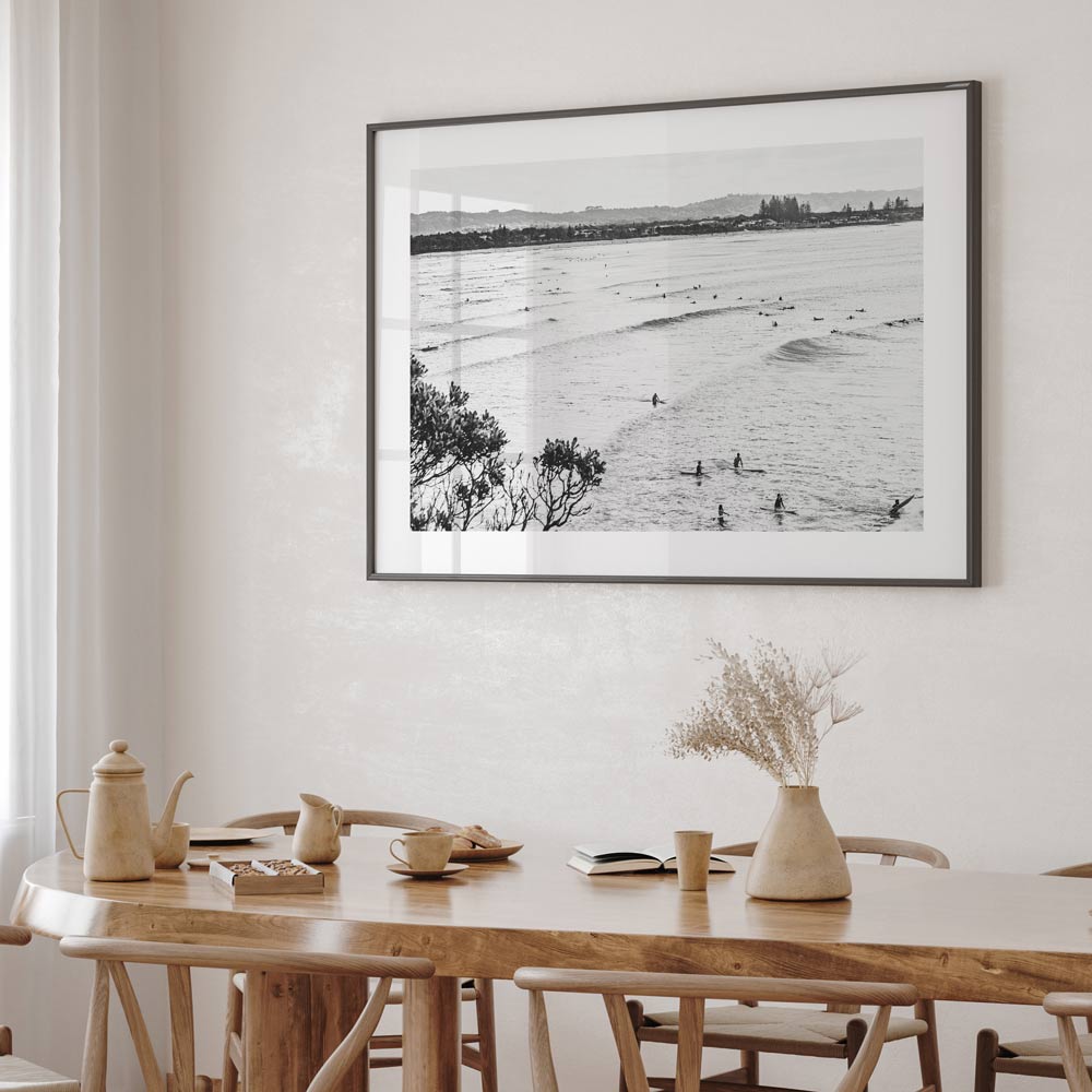 Framed photo capturing surfers at The Pass, Byron Bay - a captivating piece of wall artwork for your living space.